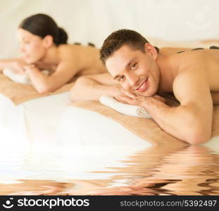 picture of couple in spa salon with hot stones