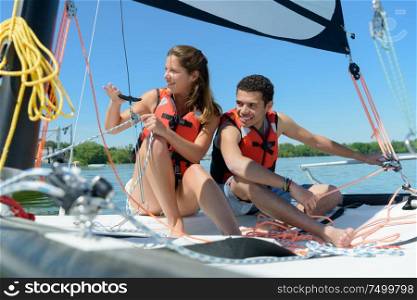 picture of couple on a sailboat