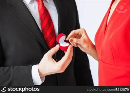 picture of couple with wedding ring and gift box
