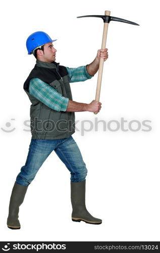 picture of craftsman holding pickaxe in profile