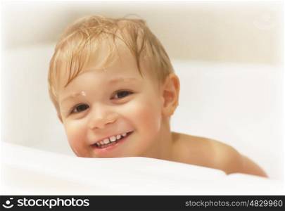 Picture of cute baby boy taking bath, happy childhood, childs hygiene, healthy adorable kid, sweet infant in bathroom, pretty toddler having fun in bathtub, baby's soap and shampoo, healthcare concept