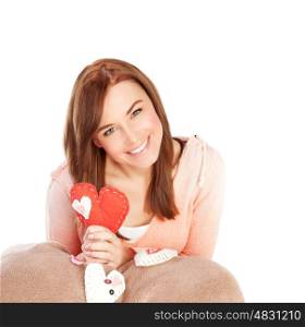 Picture of cute young lady with red handmade heart-shaped soft toy isolated on white background, Valentine day, romantic gift, lovely female, 14 of february, love and happiness concept&#xA;