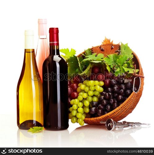Picture of different kind of wine, vine bottles and basket with variety of grapes isolated on white background, ripe fresh fruits and alcoholic grape beverage, luxury restaurant, winery product