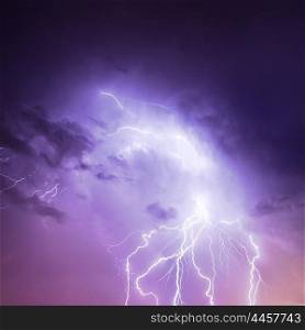 Picture of discharge lightning in cloudy purple sky, abstract natural background, thunderstorm in the rainy night, thunder and zipper, powerful electrical charge in dark blue skyscape, autumn weather