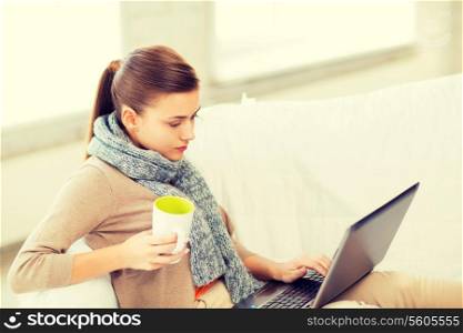 picture of diseased woman in scarf using laptop at home