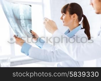 picture of doctor and nurse exploring x-ray. doctor and nurse exploring x-ray
