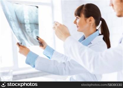 picture of doctor and nurse exploring x-ray. doctor and nurse exploring x-ray