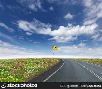 picture of empty road leading toward horizon and cloudy sky