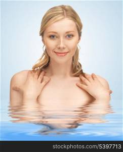 picture of face and hands of beautiful woman in water