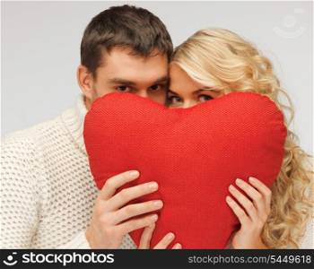 picture of family couple in a sweaters with heart