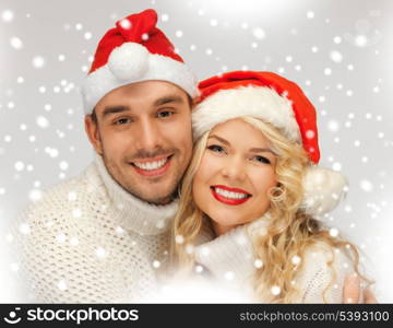 picture of family couple in sweaters and santa&#39;s hats