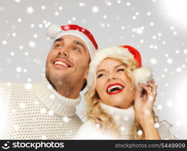 picture of family couple in sweaters and santa&#39;s hats