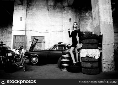 picture of fashionable woman in retro garage