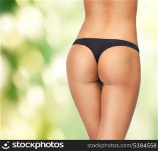 picture of female legs in black bikini panties