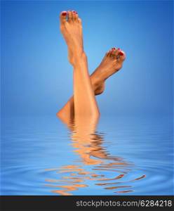 picture of female legs in blue water