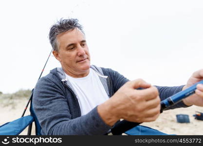 Picture of fisherman . Picture of fisherman fishing with rods