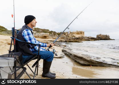 Picture of fisherman . Picture of fisherman fishing with rods