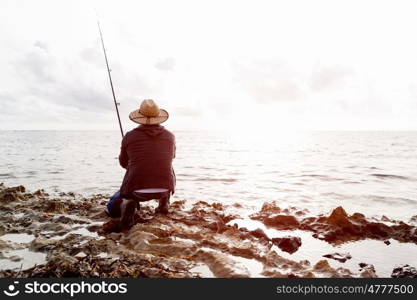 Picture of fisherman . Picture of fisherman fishing with rods