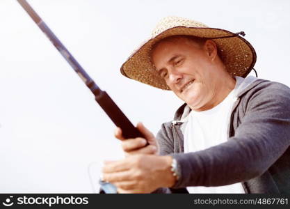 Picture of fisherman . Picture of fisherman fishing with rods