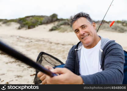 Picture of fisherman . Picture of fisherman fishing with rods