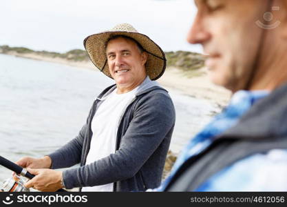 Picture of fisherman . Picture of fishermen fishing with rods