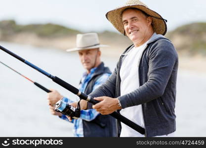 Picture of fisherman . Picture of fishermen fishing with rods