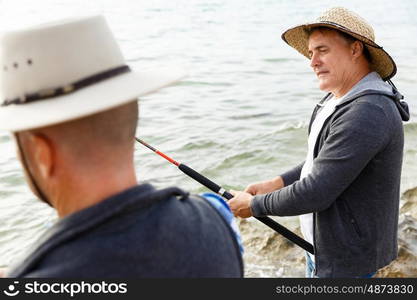 Picture of fisherman . Picture of fishermen fishing with rods