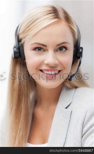 picture of friendly female helpline operator with headphones. friendly female helpline operator