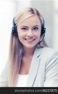 picture of friendly female helpline operator with headphones. friendly female helpline operator