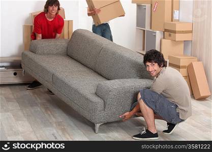 picture of friends moving a couch