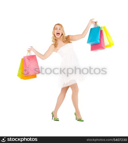 picture of funny woman with shopping bags in dress and high heels.