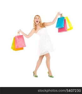 picture of funny woman with shopping bags in dress and high heels.