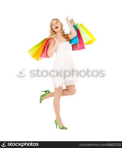 picture of funny woman with shopping bags in dress and high heels.