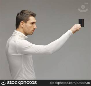 picture of futuristic man with access card.