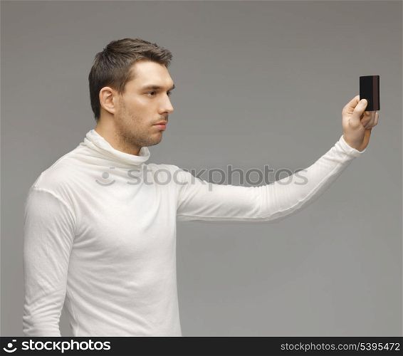 picture of futuristic man with access card.