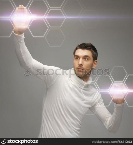 picture of futuristic man working with virtual screens