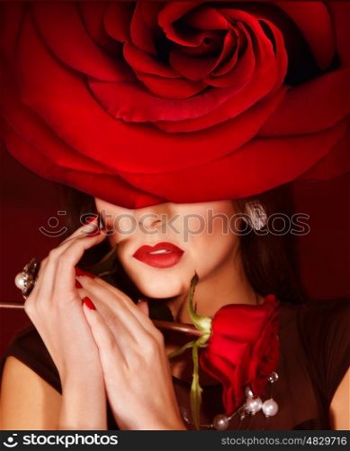 Picture of gorgeous woman wearing fashionable red roses hat, closeup portrait of brunette female with stylish makeup and flower on head, luxury beauty salon, Valentine day, style and fashion concept
