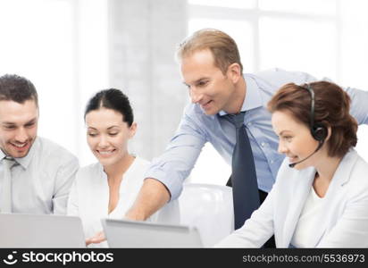 picture of group of people working in call center or office