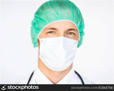 picture of half face of surgeon in medical cap and mask