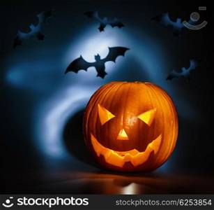 Picture of halloween holiday background, carved glowing pumpkin and black bat in dark night, jack-o-lantern, creepy nightmare, scary shadow, halloween celebration&#xA;