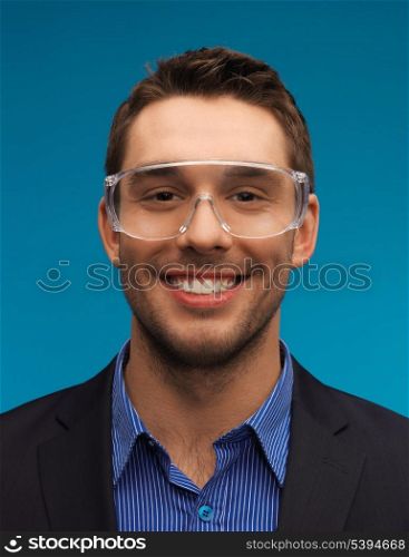 picture of handsome businessman in protective glasses.