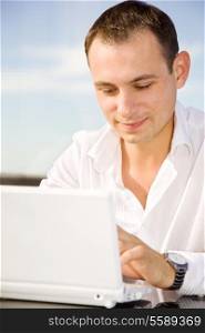 picture of handsome businessman on leisure with laptop