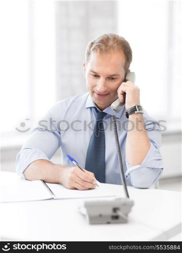picture of handsome businessman talking on the phone