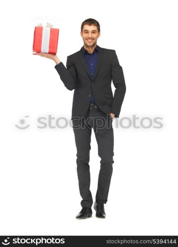 picture of handsome man in suit with a gift box.