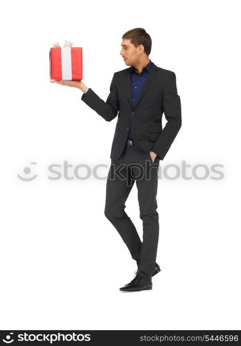 picture of handsome man in suit with a gift box.