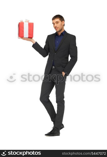 picture of handsome man in suit with a gift box.