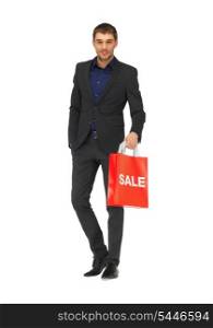 picture of handsome man in suit with sale sign.