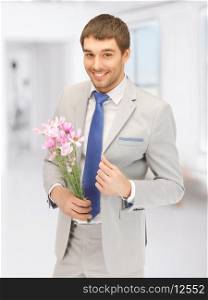 picture of handsome man with flowers in hand