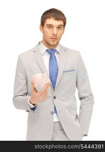 picture of handsome man with piggy bank