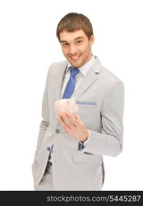 picture of handsome man with piggy bank